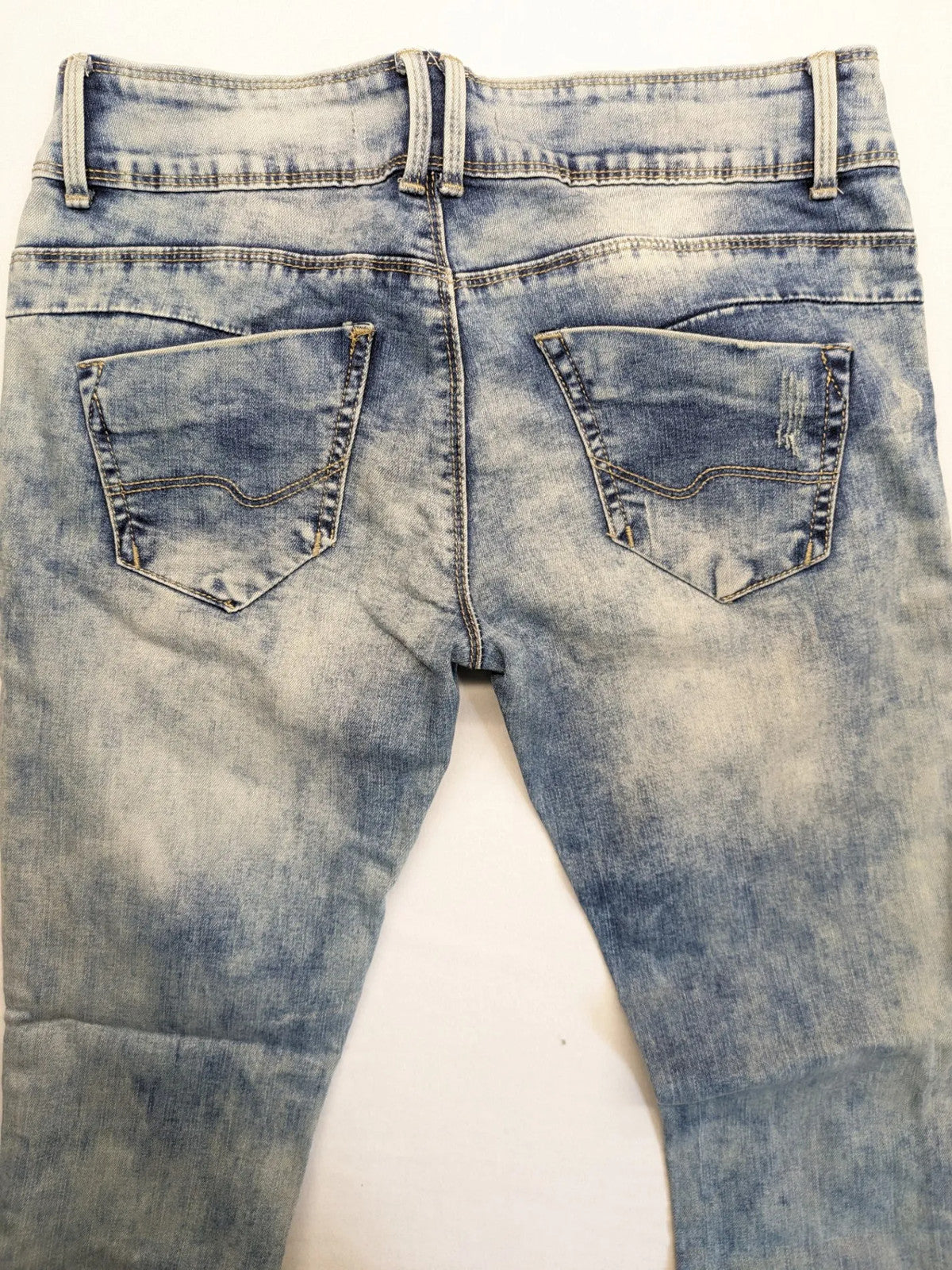 ONE LOVE DENIM blue straight jeans with distressed details and double button closure.