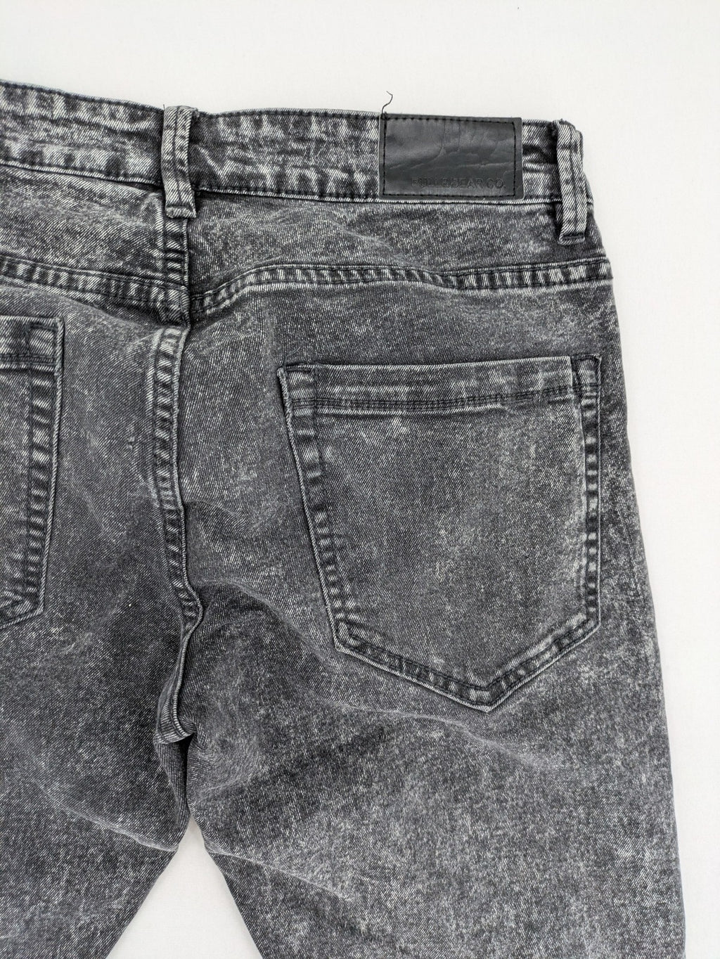Pull&Bear black acid wash straight jeans slim fit with faded denim texture.