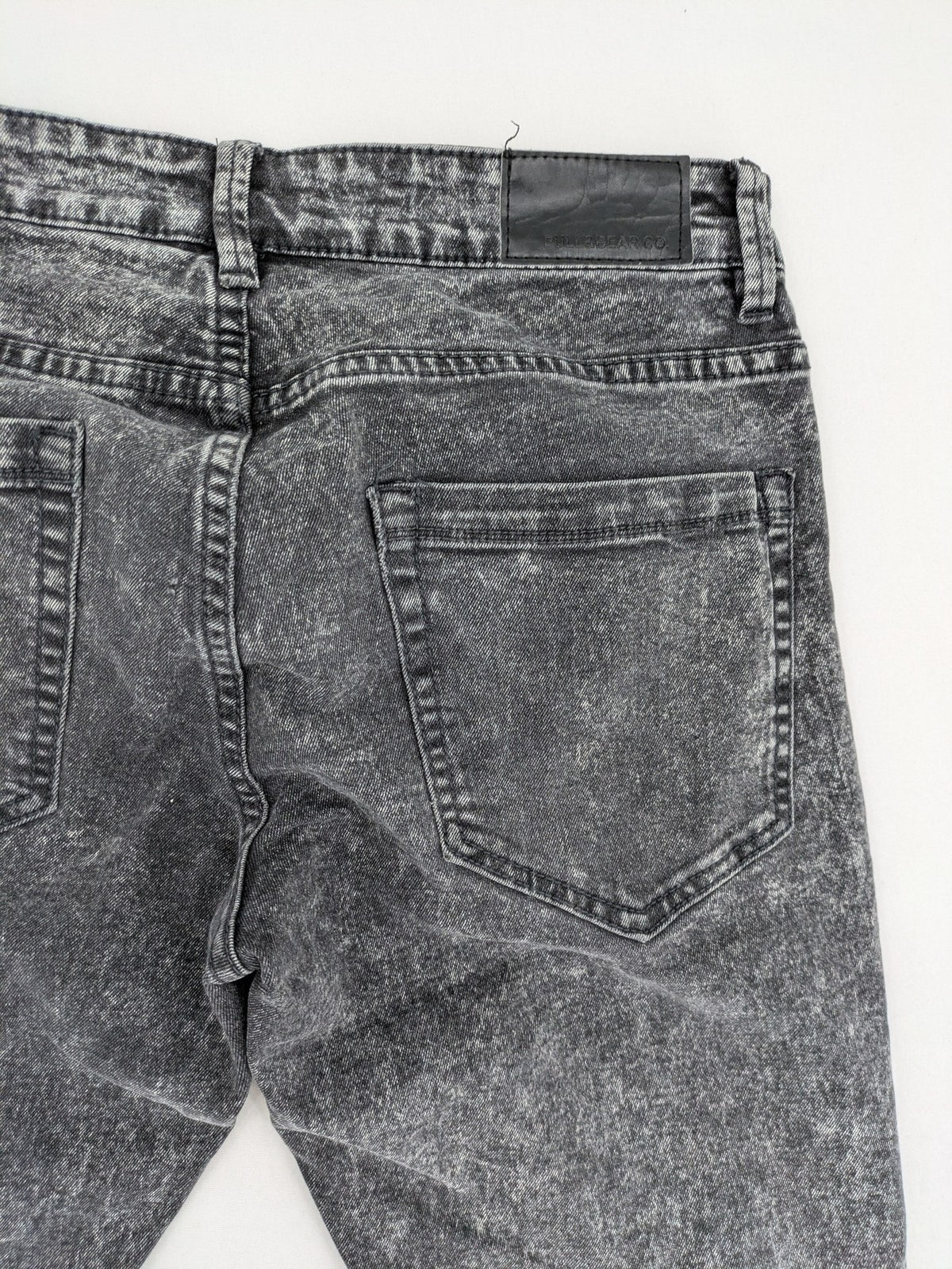 Pull&Bear black acid wash straight jeans slim fit with faded denim texture.