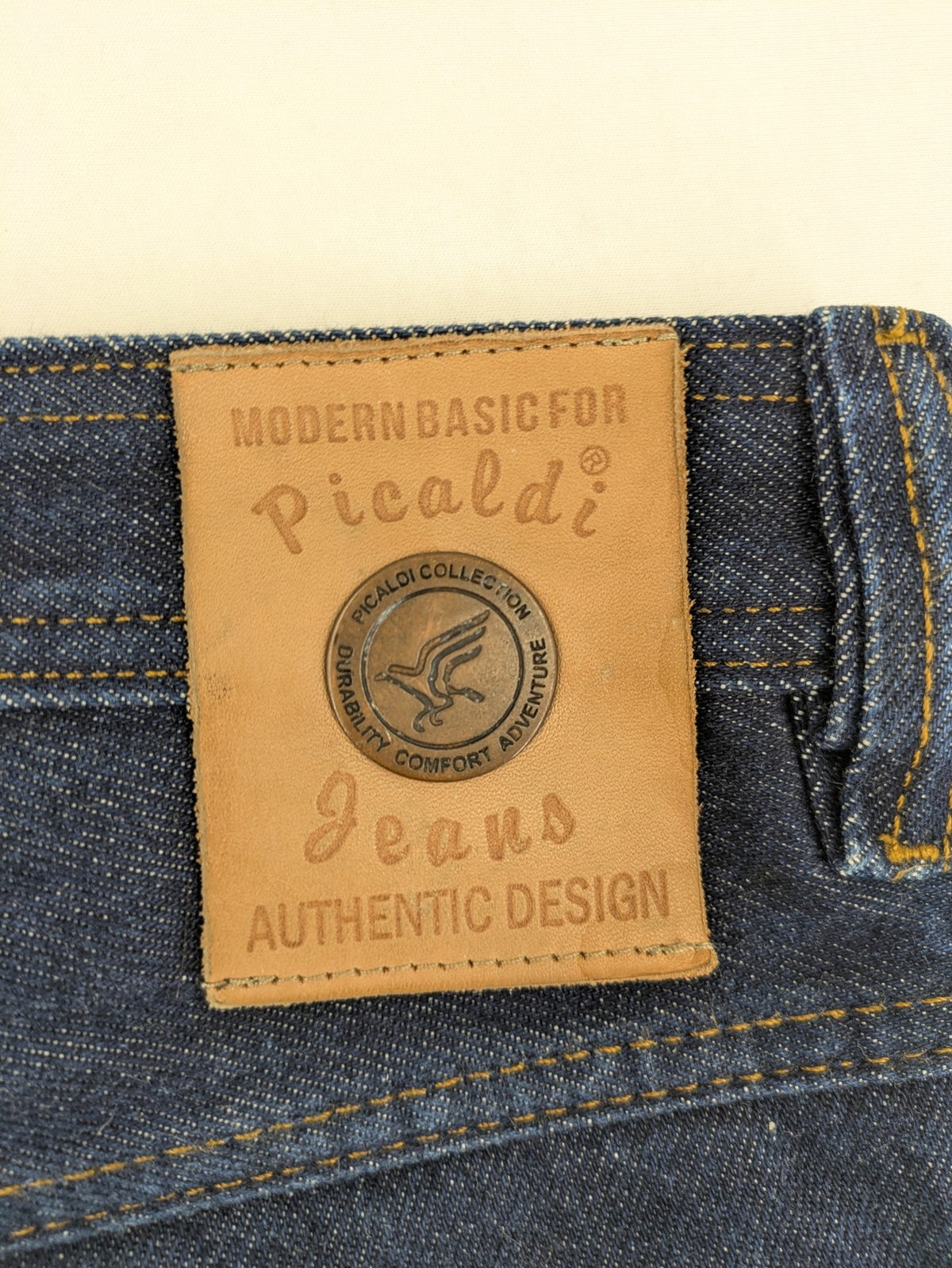Picaldi blue straight jeans with button fly and frayed hem, 5-pocket design.