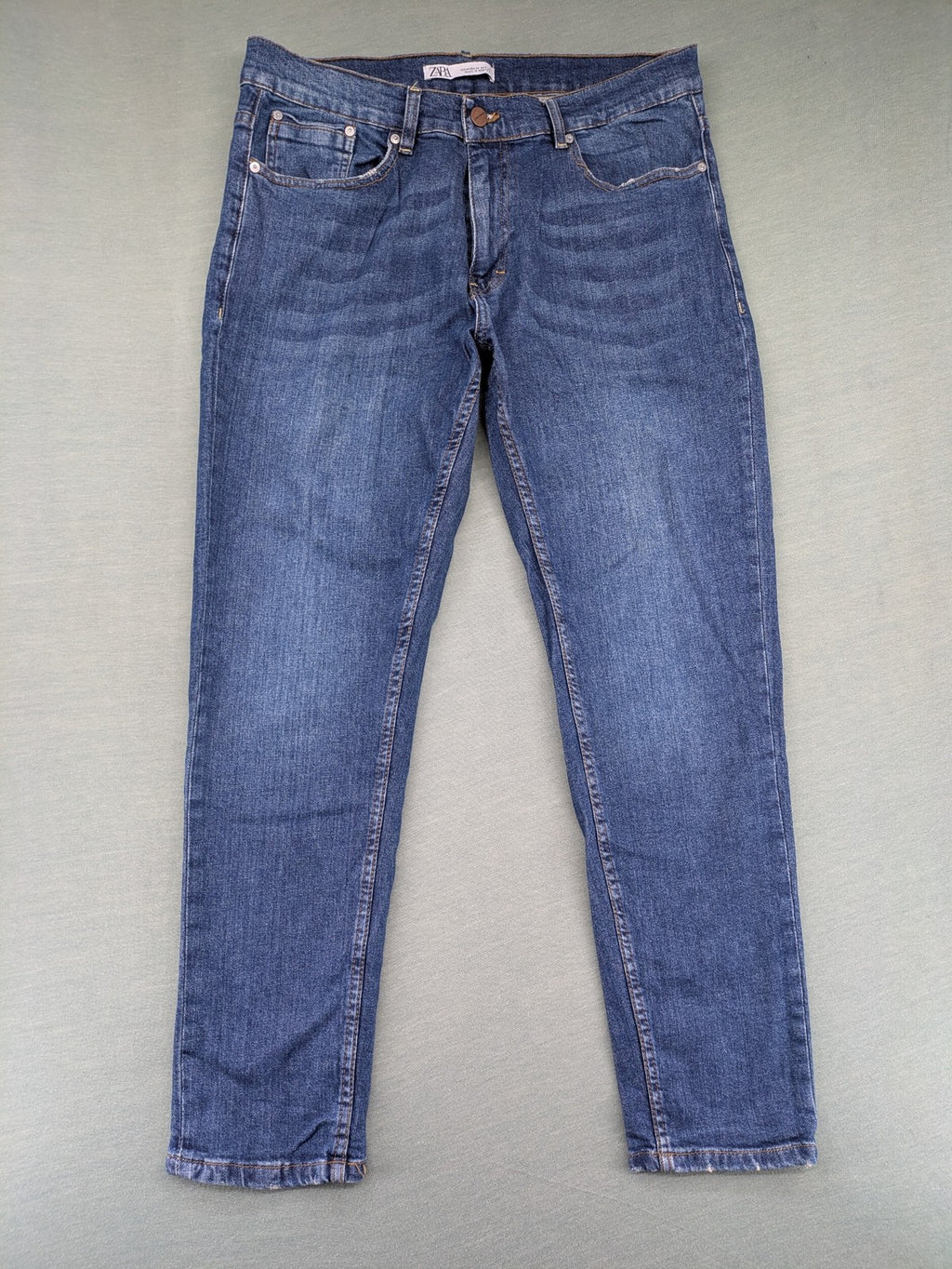 Zara blue straight jeans with medium wash, lightweight denim, and regular fit.