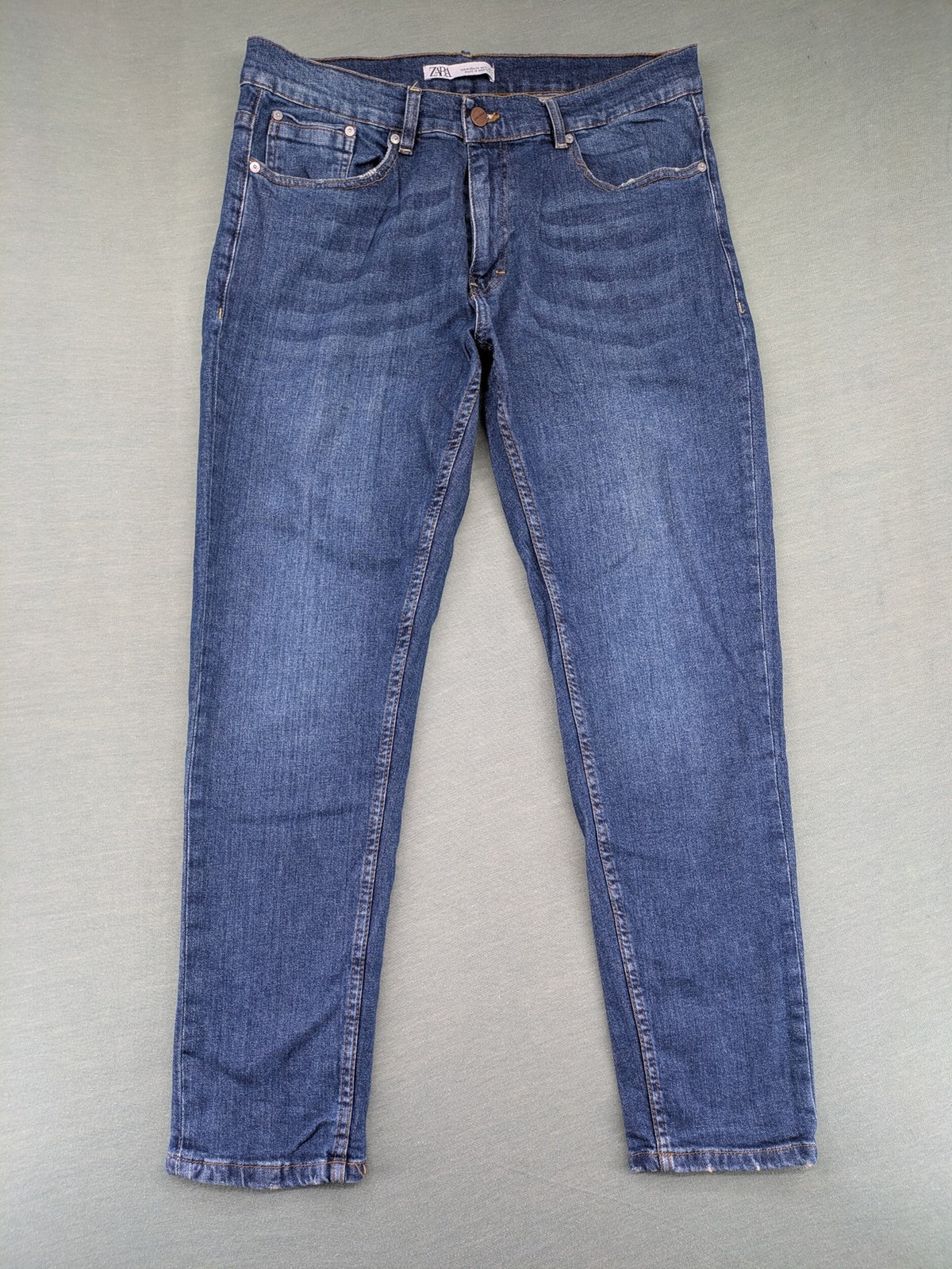 Zara blue straight jeans with medium wash, lightweight denim, and regular fit.