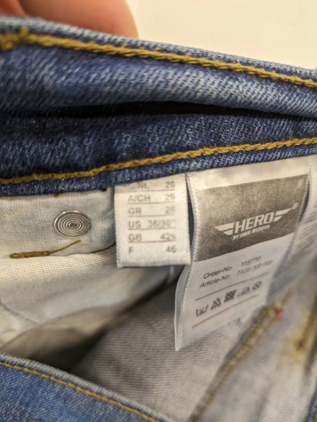 Hero By John Meddox blue straight jeans with five-pocket design and zip fly.