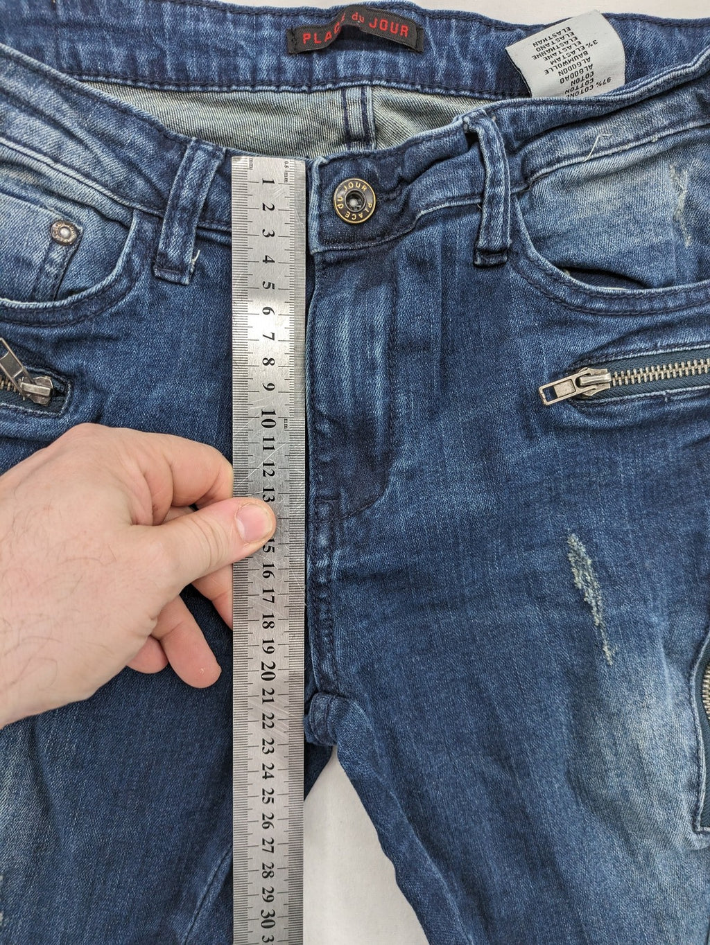 Place du Jour blue biker jeans with zippers, used-look wash, and star rivet detail.