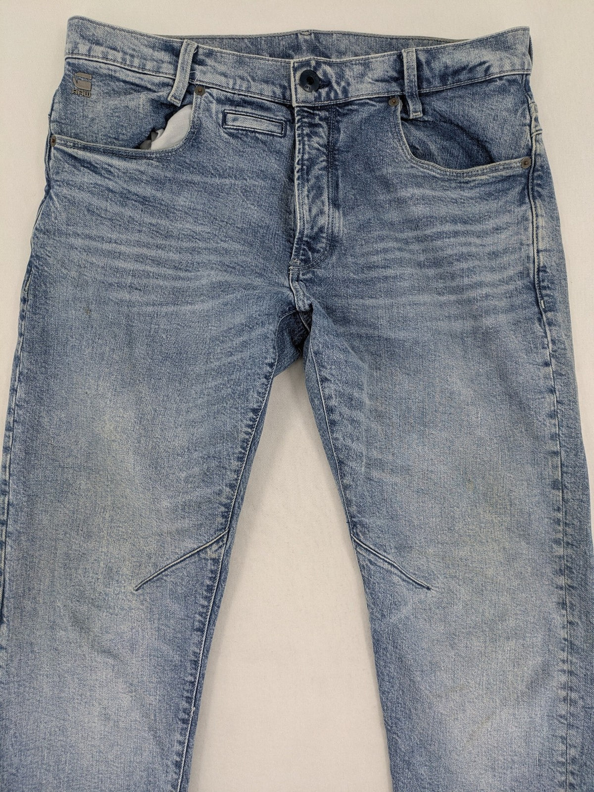 G-Star Raw blue slim fit jeans with 5-pocket design and light wash denim.