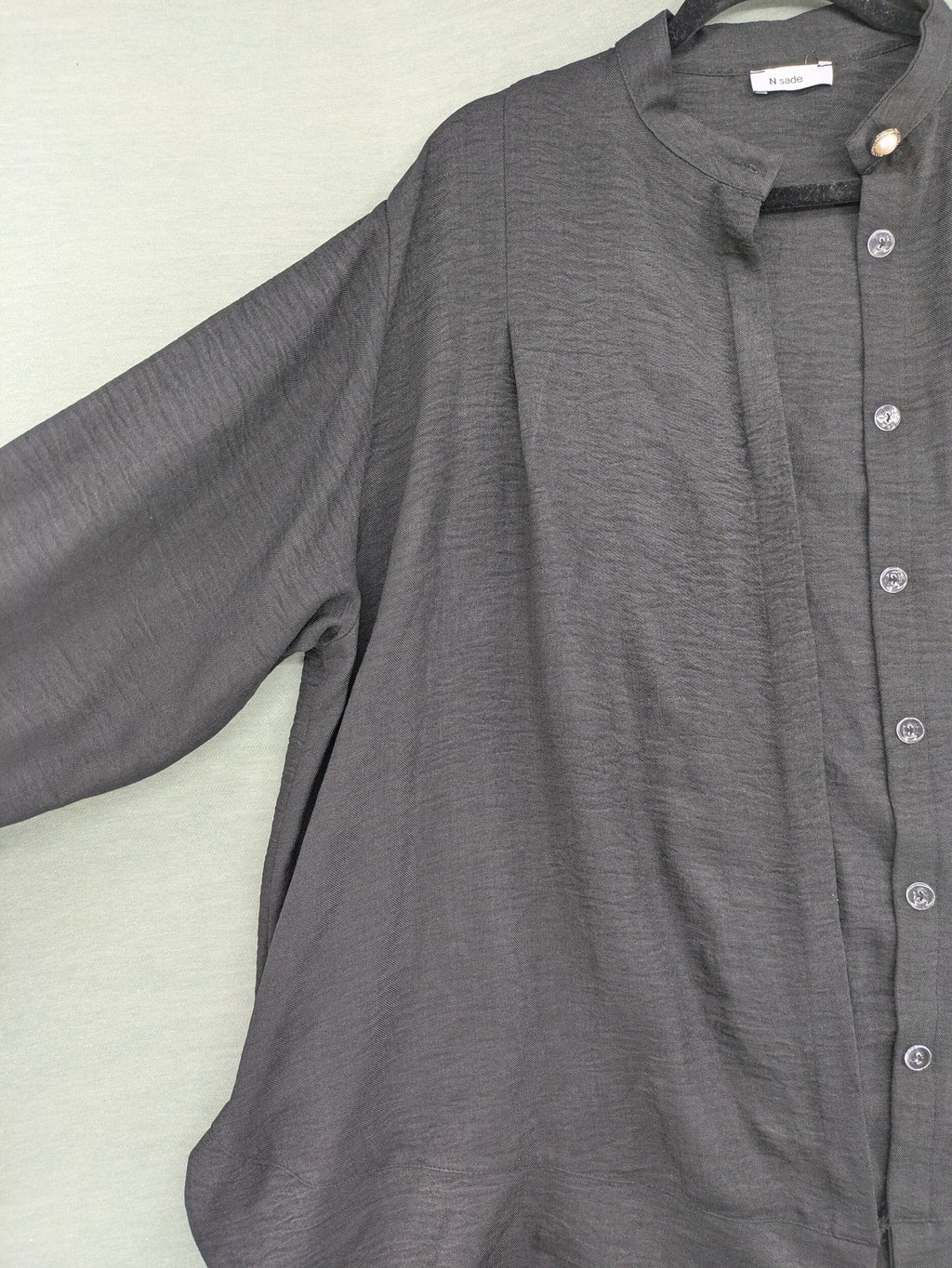 Damen grey turtle neck jumper with balloon sleeves and side ties, high-low hem.