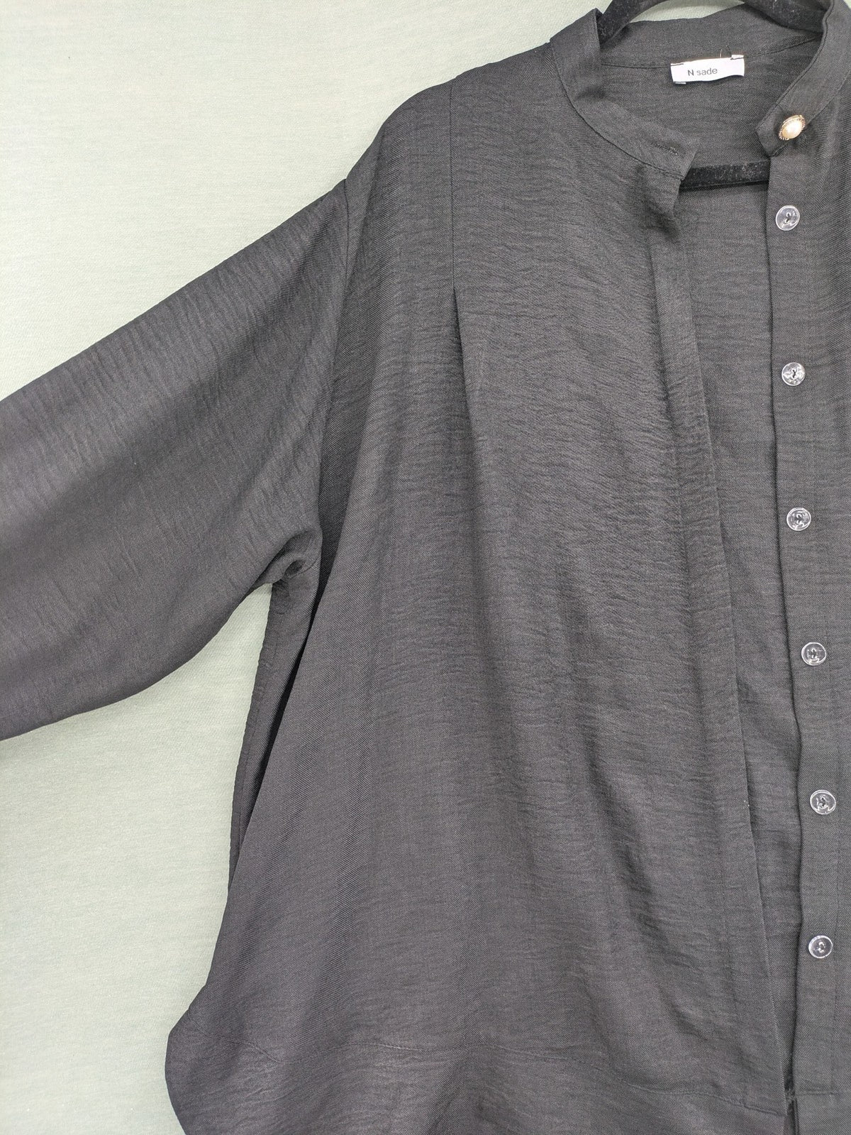 Damen grey turtle neck jumper with balloon sleeves and side ties, high-low hem.