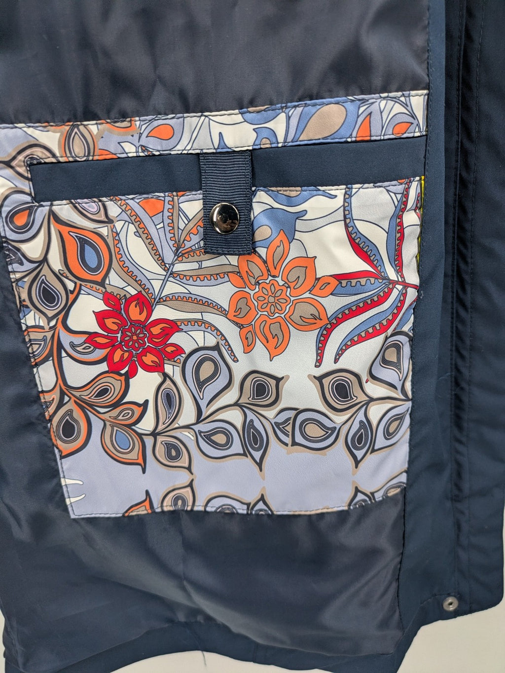 everYou navy parka jacket with hood, adjustable drawstring, patterned lining, button closure.