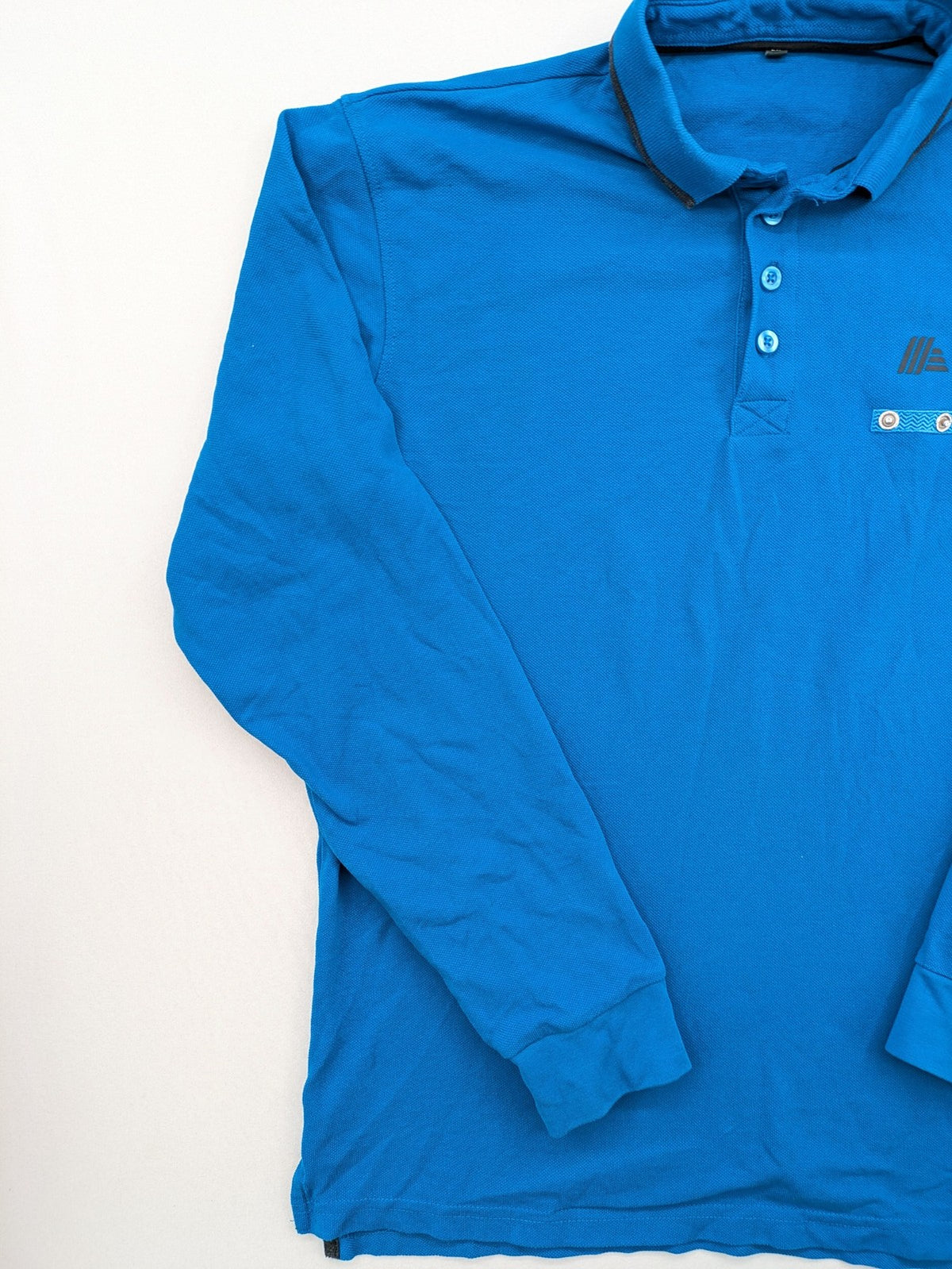 Aldi blue long sleeve polo shirt with embroidered logo and classic collar.