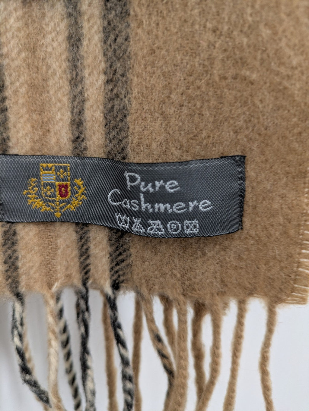 Karo unisex scarf camel brown tartan pattern 100% cashmere with black, white, and red accents.
