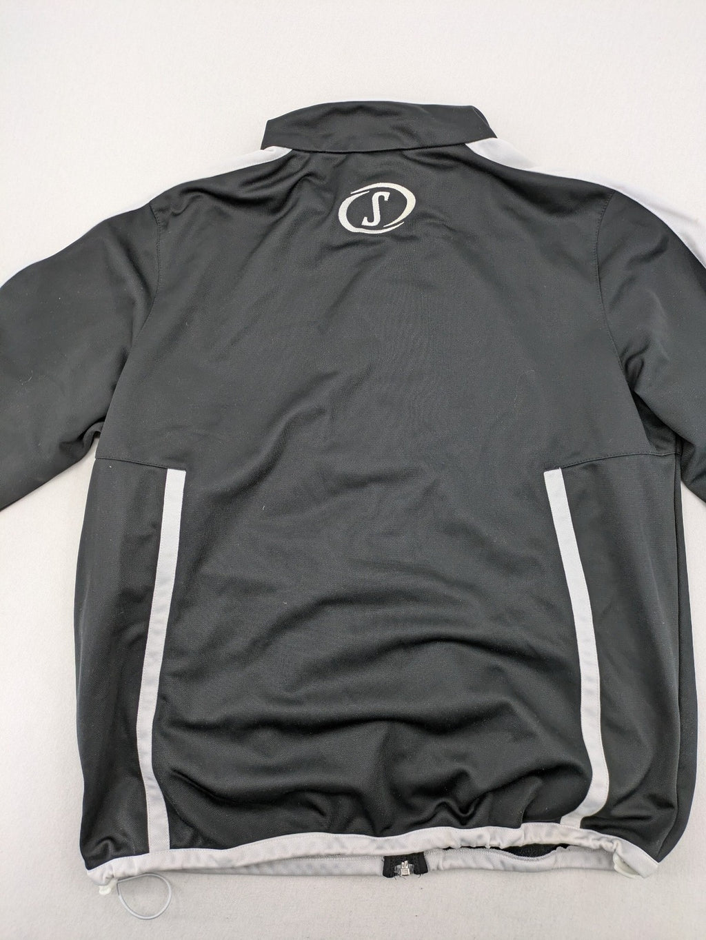 Spalding black training jacket with orange and white accents, Rasta Vechta logo, zip front.