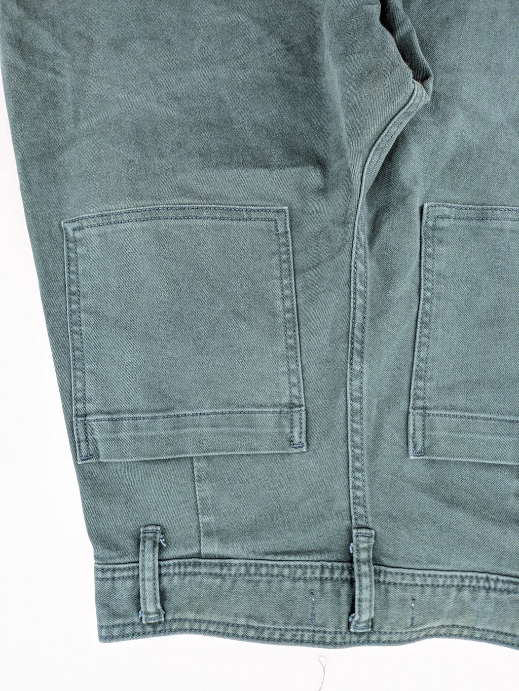 Zara green high waist wide leg jeans with frayed hem and button closure.