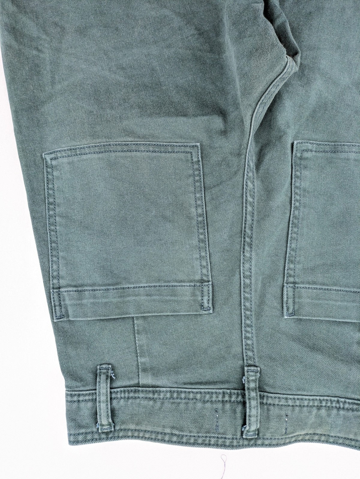 Zara green high waist wide leg jeans with frayed hem and button closure.