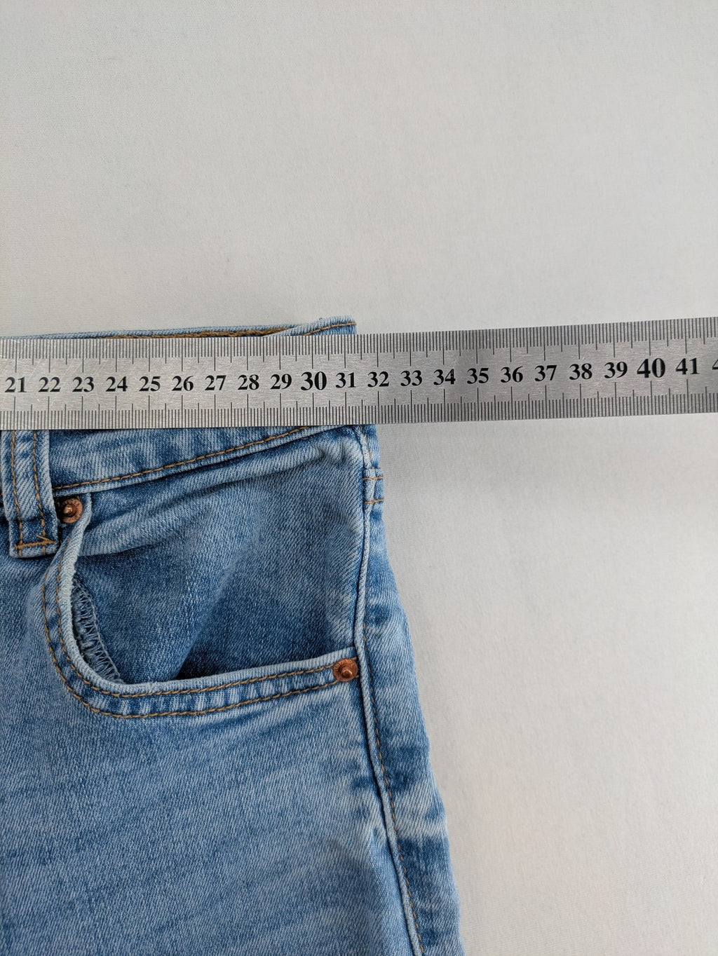 Bershka blue super high waist skinny jeans with washed denim finish and zip closure.