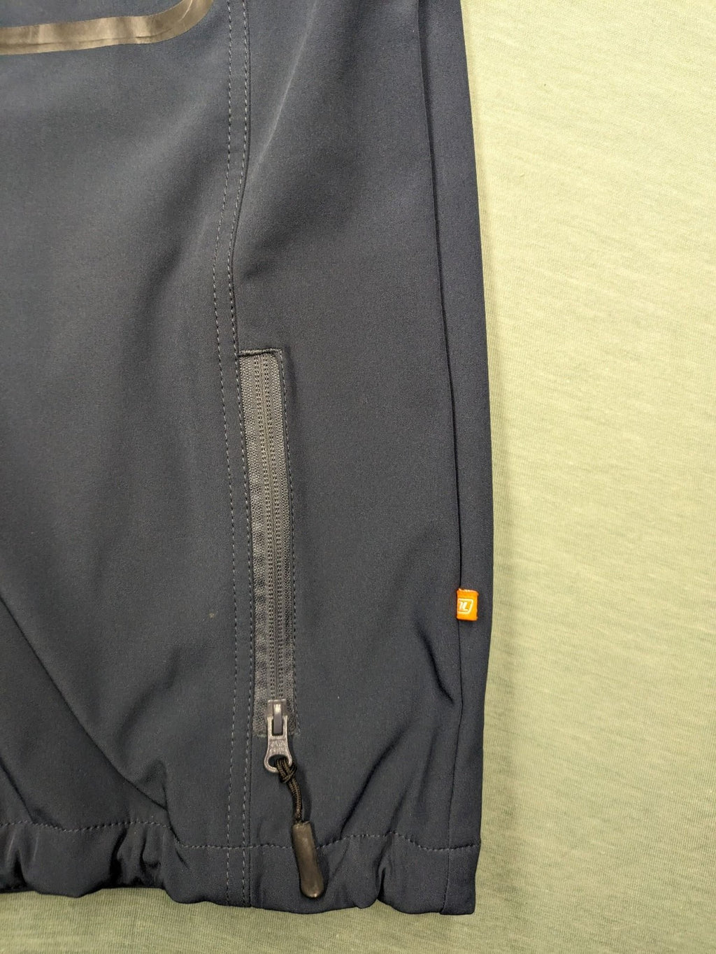 Life Line grey softshell jacket with adjustable hood and durable wind-resistant material.