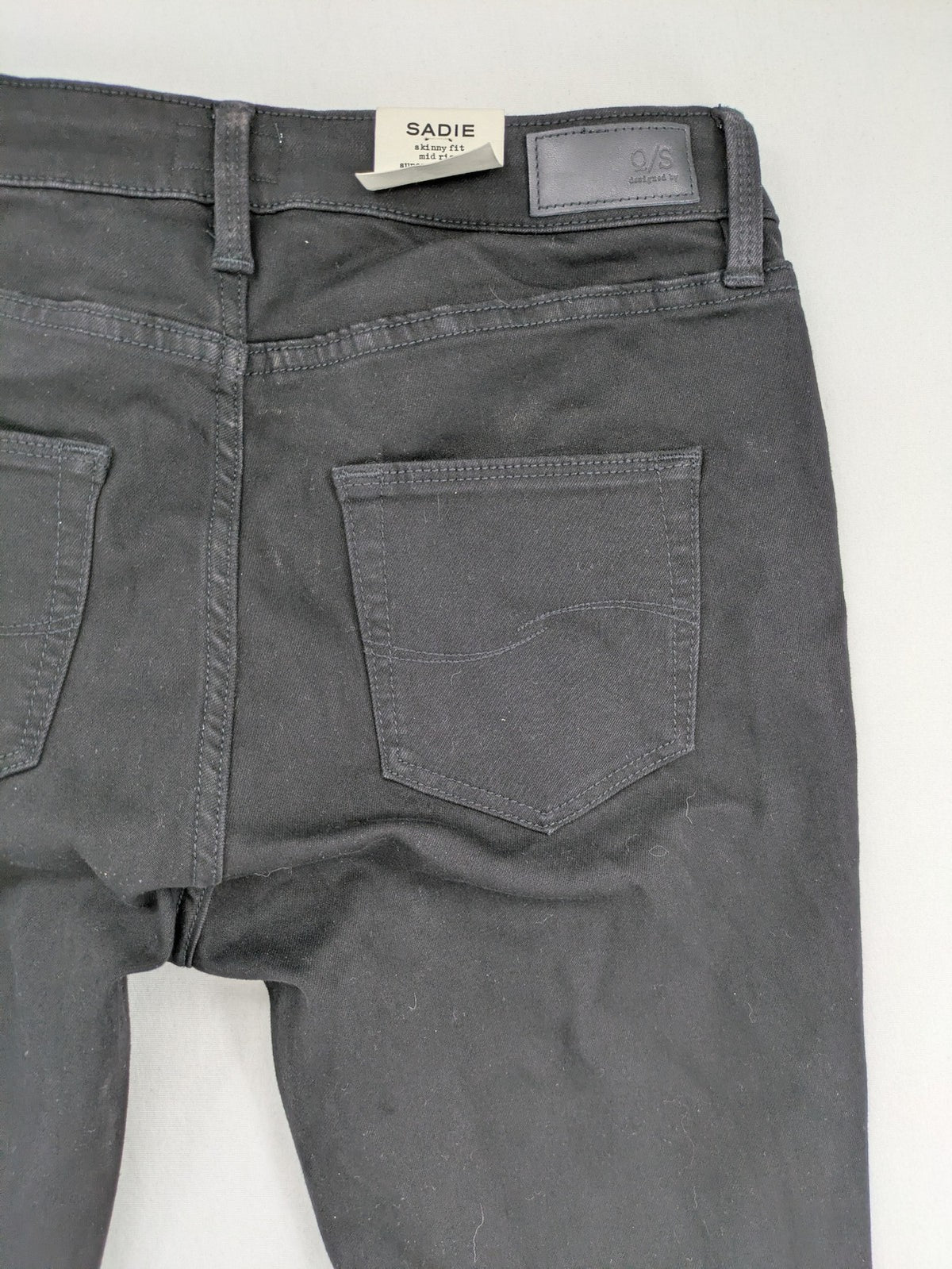 Q/S skinny fit jeans black mid-rise with stretch fabric and sleek silhouette.