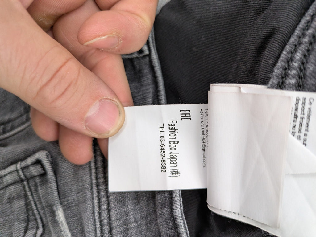 Replay grey straight jeans faded wash five-pocket style with logo on pocket.