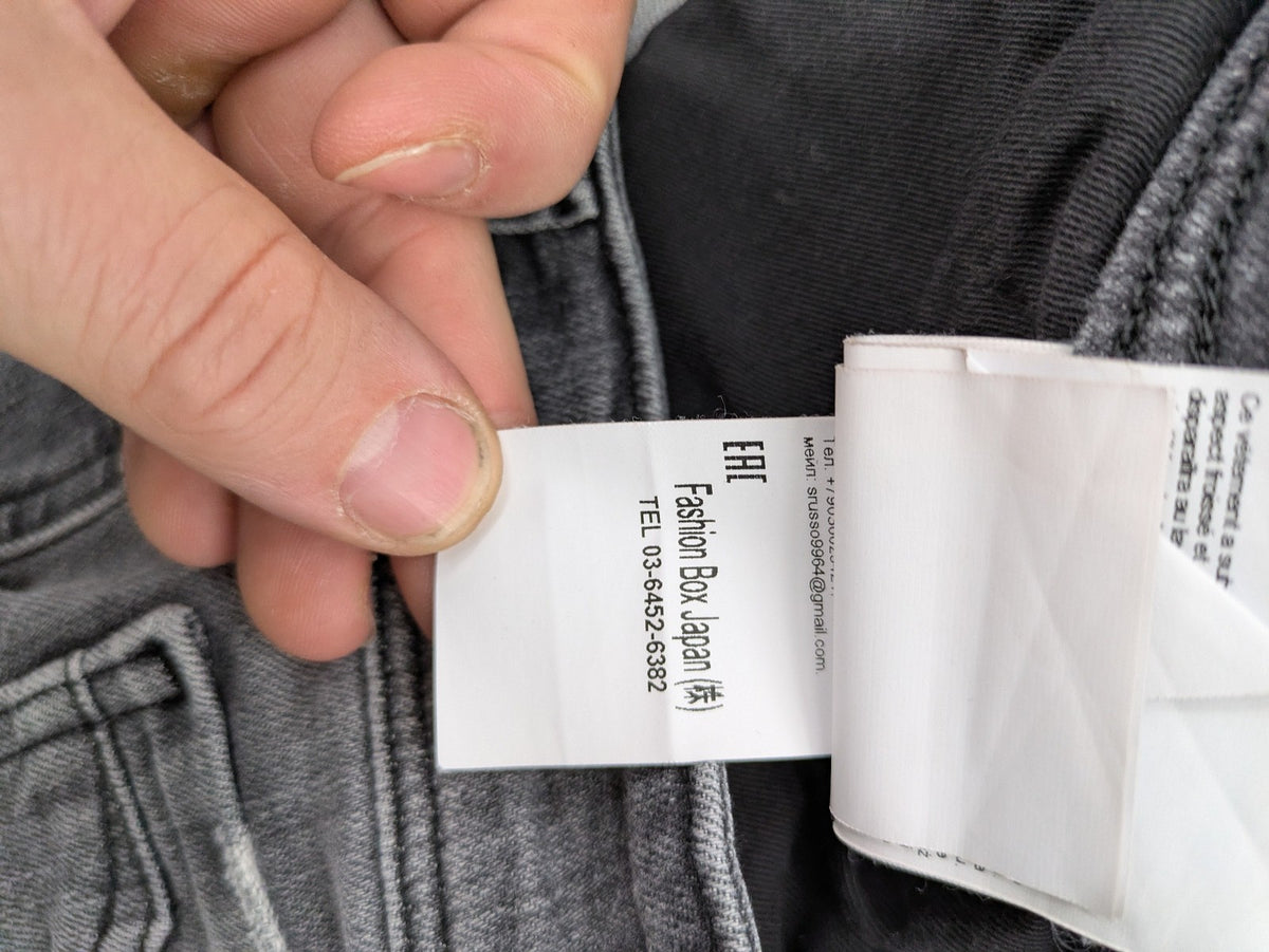 Replay grey straight jeans faded wash five-pocket style with logo on pocket.