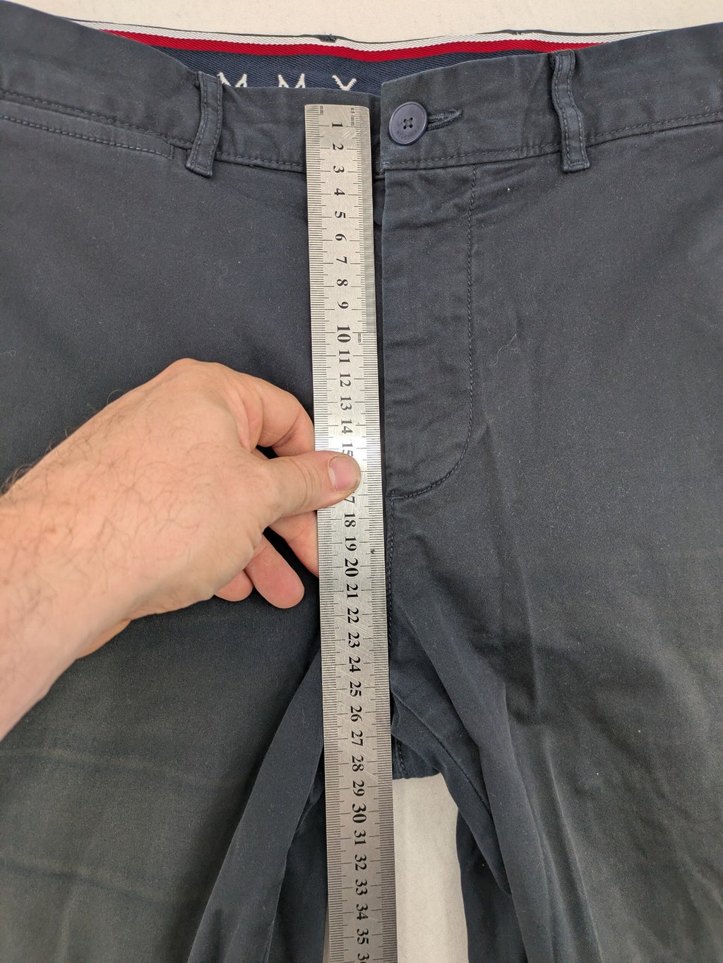 Tommy Hilfiger grey chino pants with TH-Flex stretch technology and classic straight fit design.