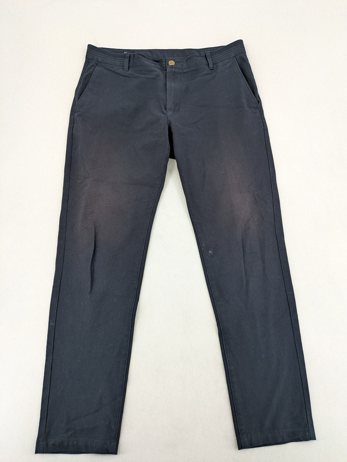 Zara navy chinos flat front design with stretch fabric for comfort and versatility.