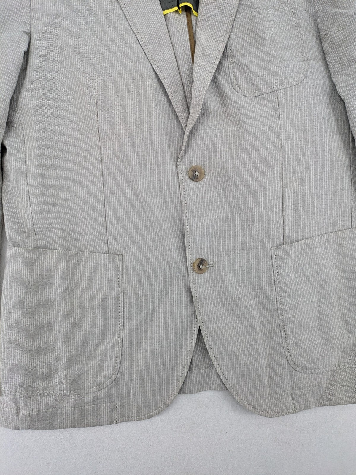 Camel Active grey cord blazer with classic two-button closure and practical zippered inner pockets.