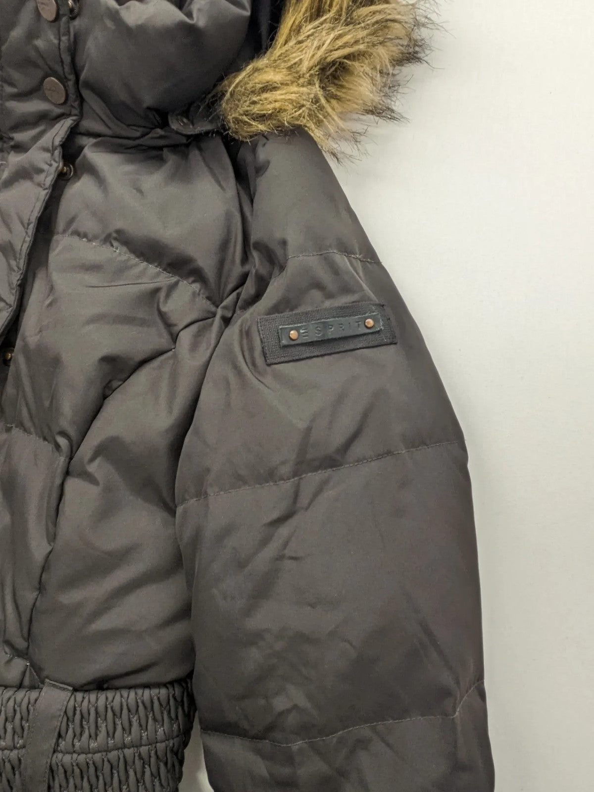 Esprit black quilted coat with removable faux fur hood and elastic waist belt.