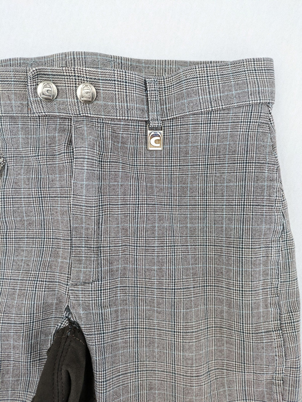 Cavallo grey check riding pants with brown full-seat patch and logo detail.