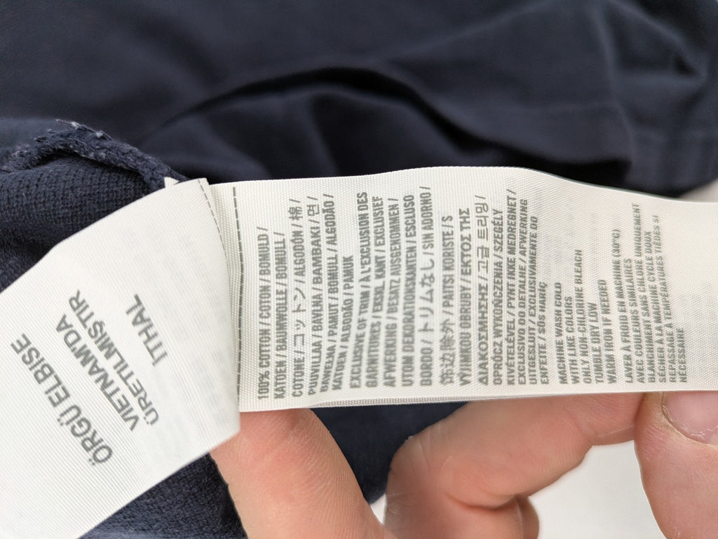 Hollister navy polo shirt with embroidered seagull logo and classic collar.