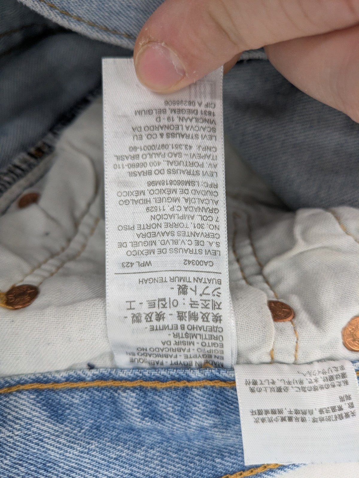 Levi's blue straight jeans light wash denim with button fly and classic fit.