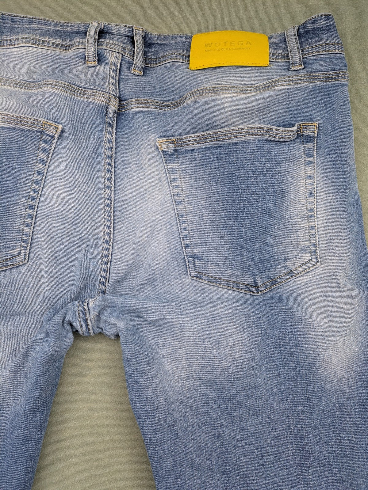 Wotega blue straight jeans light wash faded with classic 5-pocket design and stretch material.