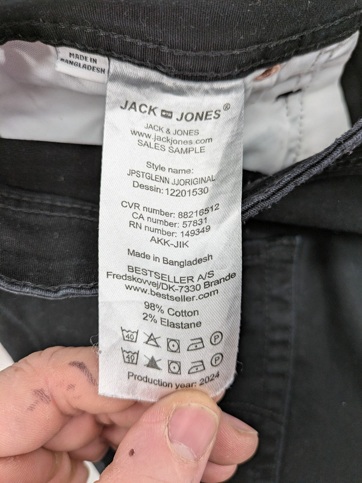 Jack & Jones black slim fit jeans with logo patch and cotton-stretch blend.