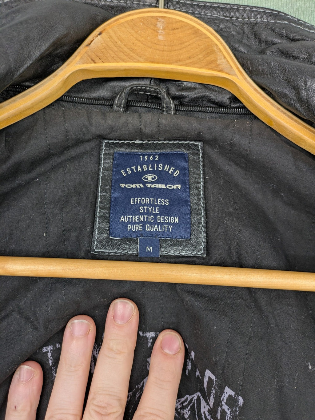Tom Tailor black leather jacket vintage style with multiple pockets and contrast stitching.