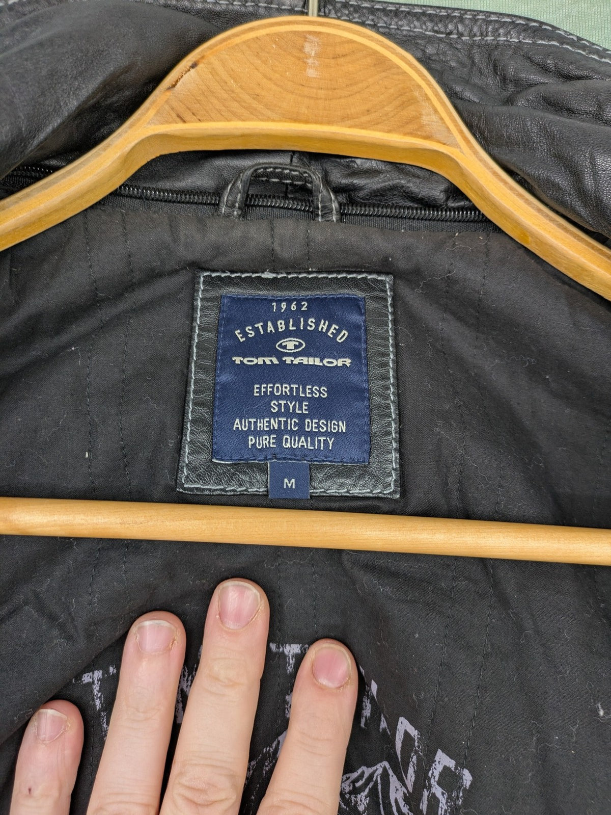 Tom Tailor black leather jacket vintage style with multiple pockets and contrast stitching.
