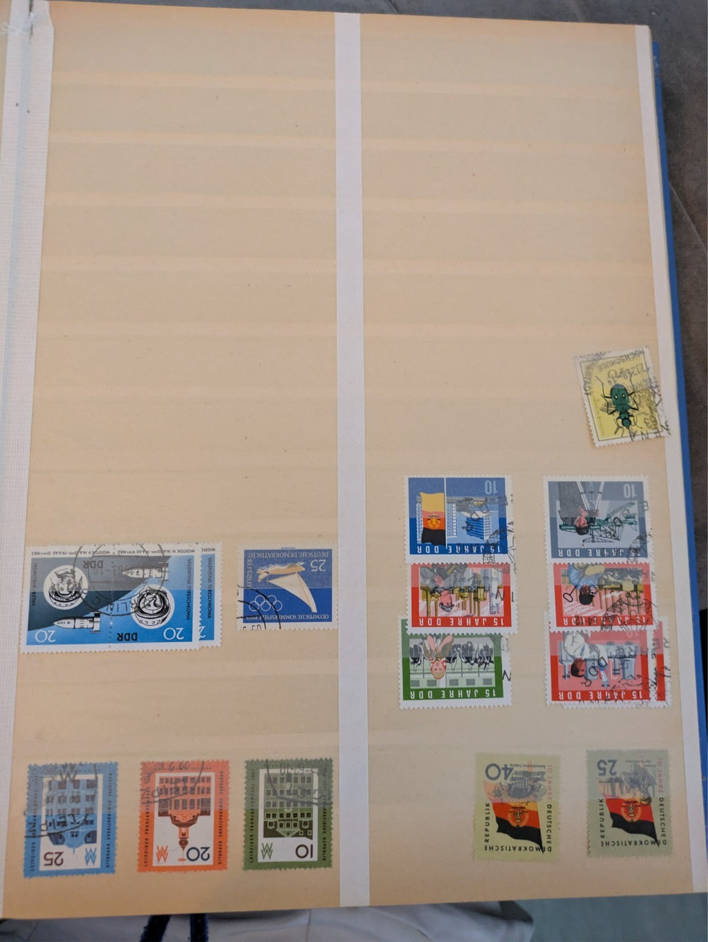 Beige postage stamp album featuring over 1000 stamps from Germany and Europe.