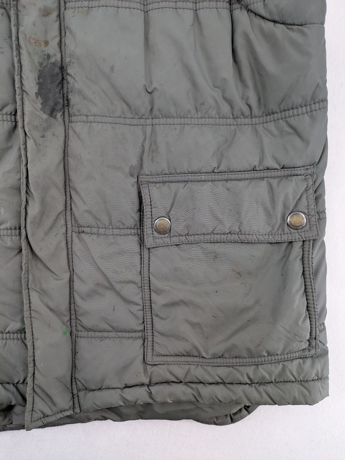 Camargue grey quilted jacket with fleece collar and buttoned pockets.