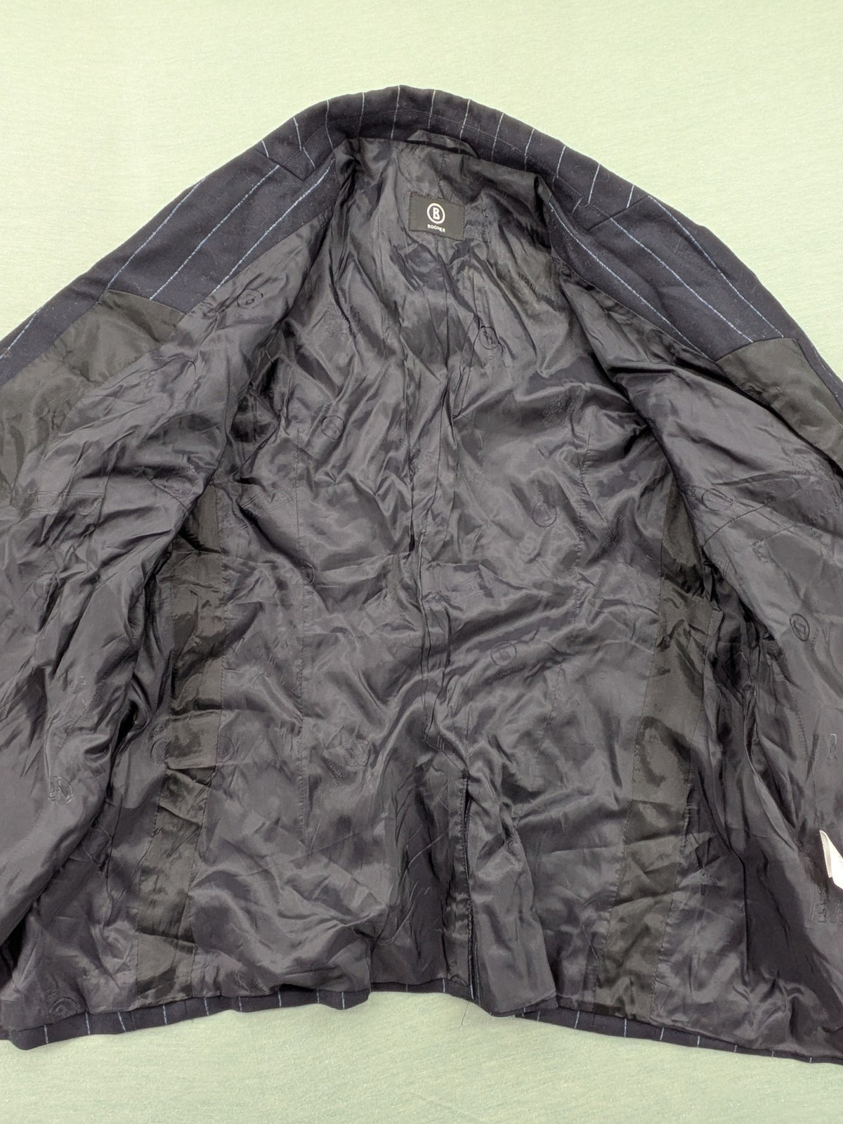 Bogner grey blazer with black pinstripes and contrast stitching, made of 100% virgin wool.