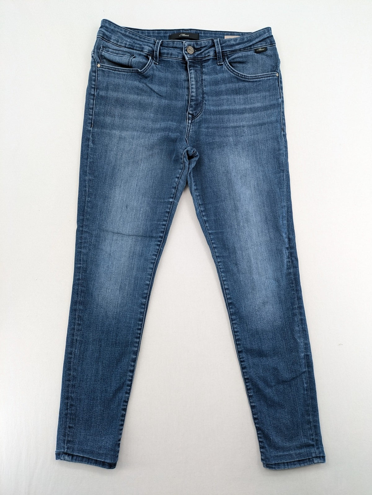 Mavi blue high rise super skinny jeans with medium wash and stretch denim material.