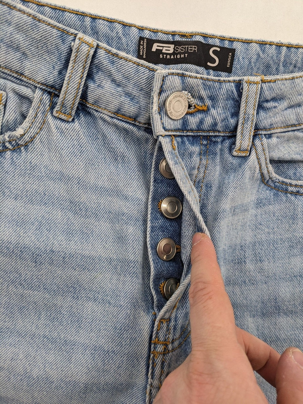 FB Sister blue straight leg jeans high rise with distressed detailing and button fly.