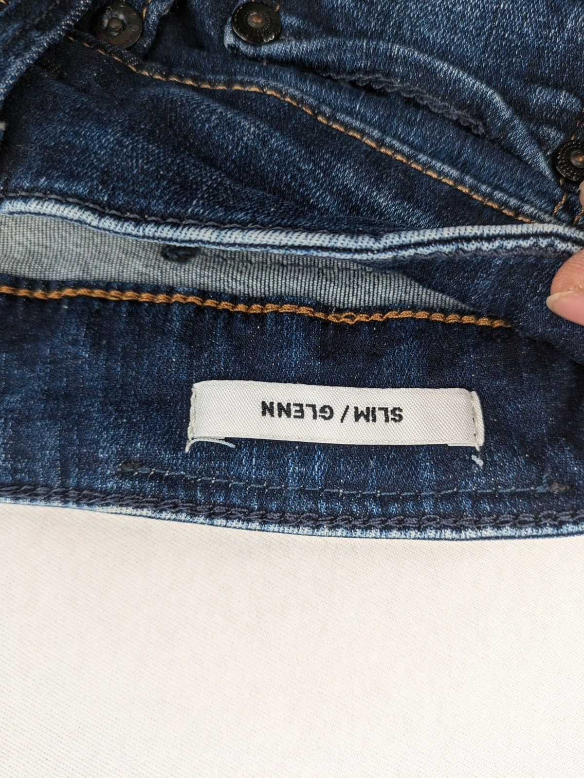 Jack & Jones blue slim fit jeans with faded wash and classic button fly.