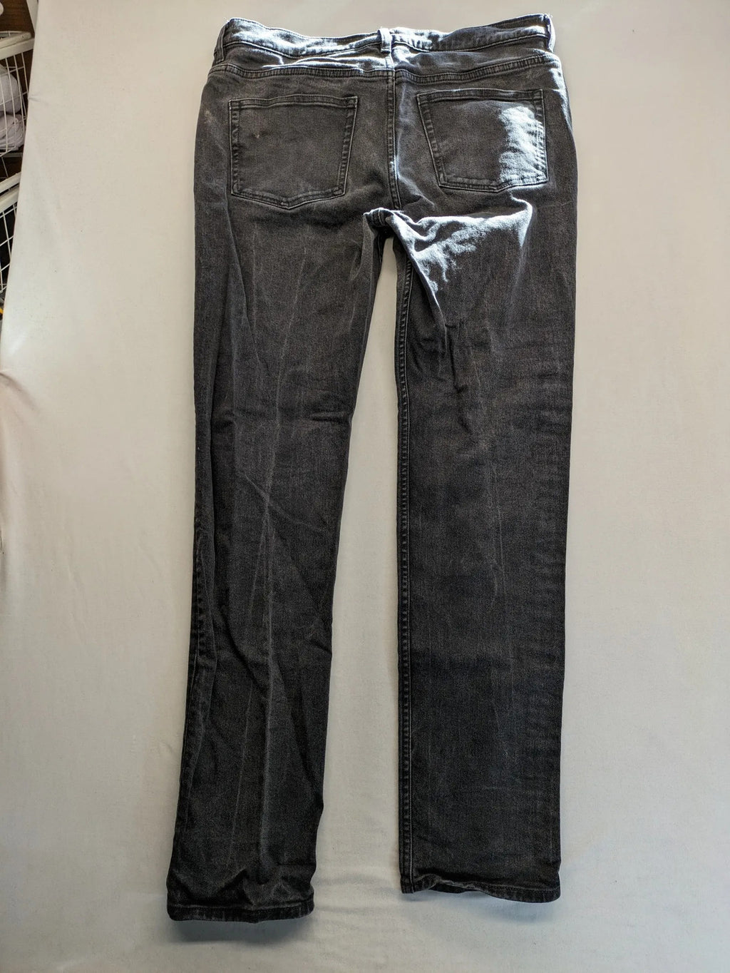 COS grey straight jeans with classic 5-pocket style and washed denim texture.