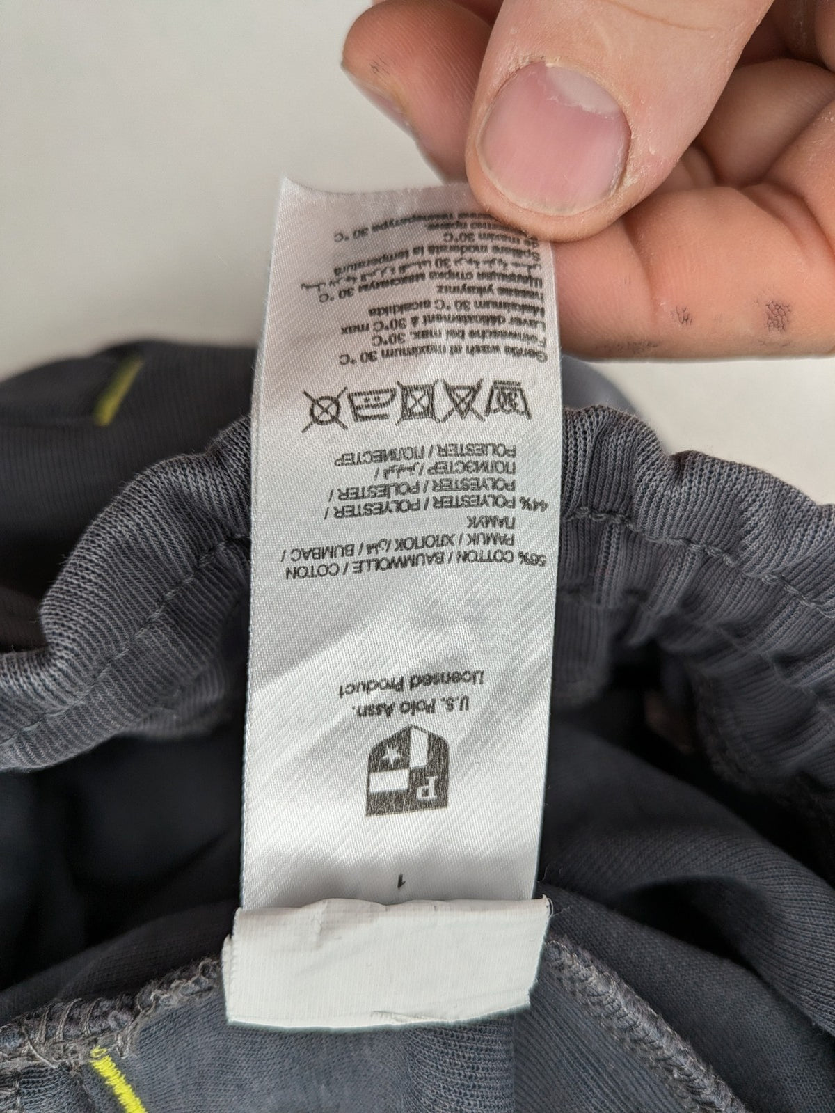 US Polo Assn grey sweatpants with light green drawstring and subtle logo detail.