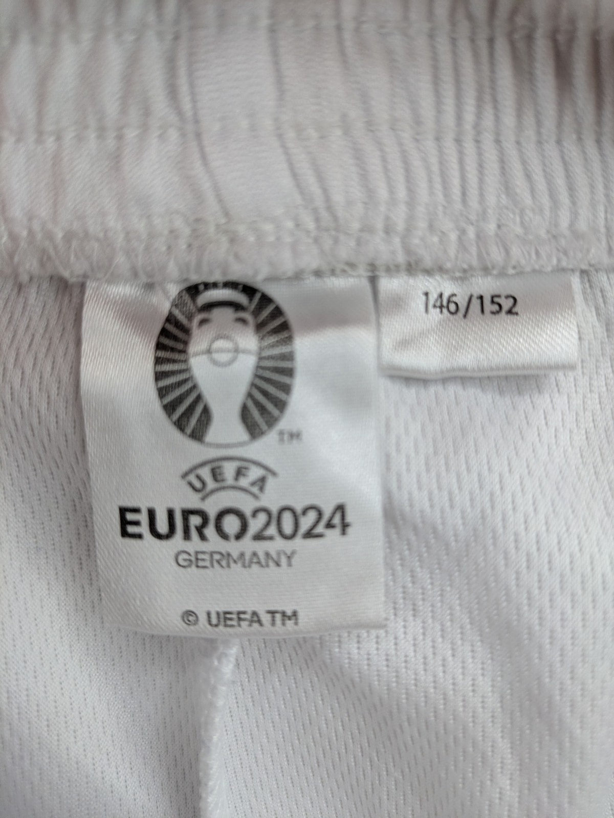 UEFA EURO 2024 white shorts with Germany crest and logo, elastic waistband, breathable material.