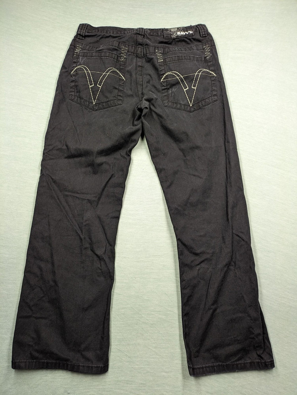 Savvy black pants straight fit with button fly, embroidered details and unique stitching.