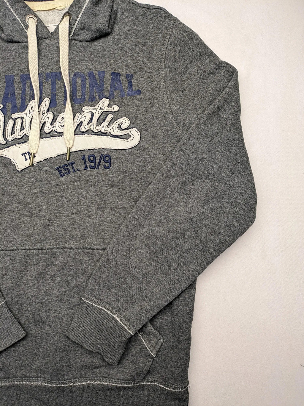 Livergy grey zip-through hoodie with "Traditional Authentic" graphic, kangaroo pocket, soft material.