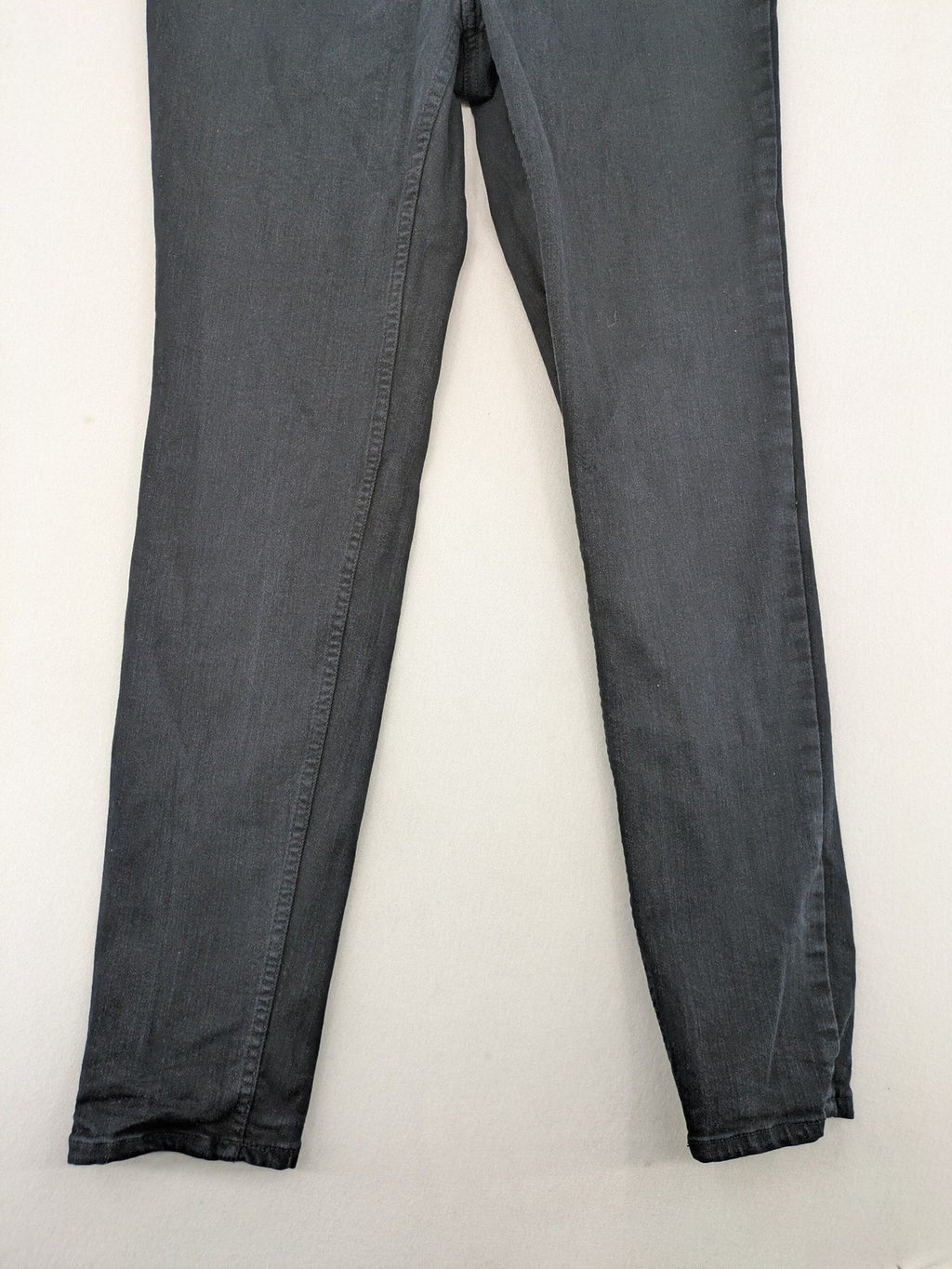 H&M grey skinny jeans with faded wash and soft stretch denim material.