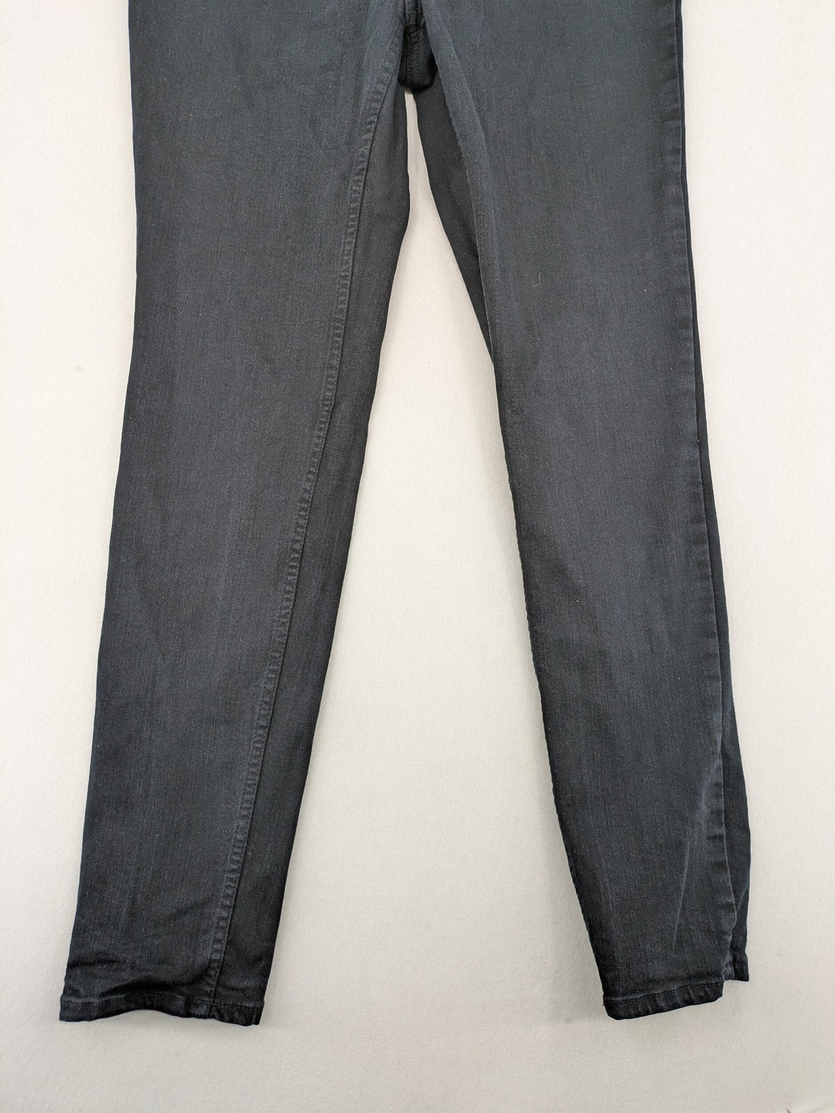 H&M grey skinny jeans with faded wash and soft stretch denim material.