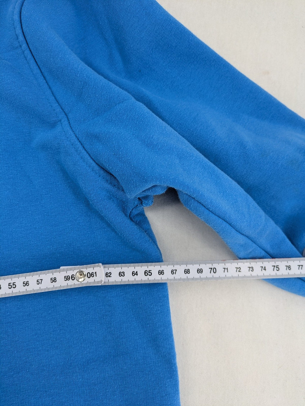Masters of the Universe blue zip-through hoodie featuring large He-Man logo and drawstring hood.