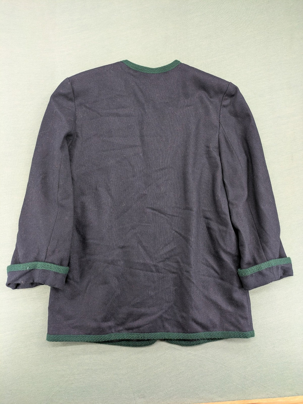 Blazer green and navy jacket with embroidered details and silver buttons.