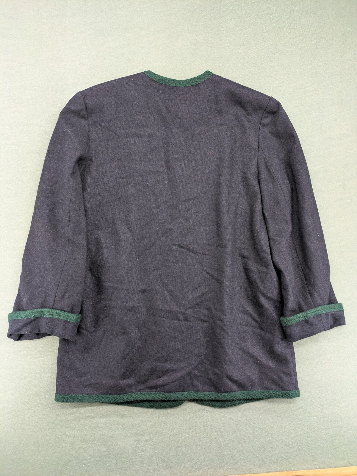 Blazer green and navy jacket with embroidered details and silver buttons.