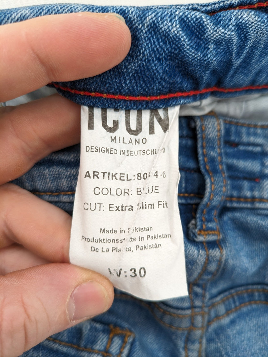 Milano straight jeans light blue distressed with red splatter and extra slim fit.
